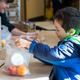 Child picks up free school lunch in cafeteria
